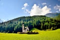 Church in the foothills of the Dolomites. Funes Valley, Dolomites, Italy. St John church under autumn sun Royalty Free Stock Photo