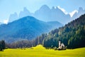 Church in the foothills of the Dolomites. Funes Valley, Dolomites, Italy. St John church under autumn sun Royalty Free Stock Photo