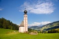 Church in the foothills of the Dolomites. Funes Valley, Dolomites, Italy. St John church under autumn sun Royalty Free Stock Photo