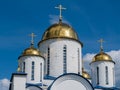 Church with golden domes and crosses on blue sky background Royalty Free Stock Photo