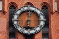 Church of Holy Family. Magnificent Catholic church of early 20th century. Fragment of building. Close-up of clock on tower Royalty Free Stock Photo