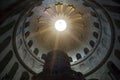 Church of the Holy Sepulcher through the top of which passes sunlight with rays. Royalty Free Stock Photo