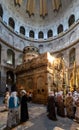 Church of the Holy Sepulchre interior with pilgrims at Aedicule or Holy Sepulchre chapel in Rotunda in Christian Quarter of Royalty Free Stock Photo