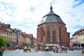 Church of the Holy Spirit called `Heiliggeistkirche` in German at marketplace in historical city center on sunny day