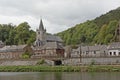 Church and houses along river Meuse in Dinant