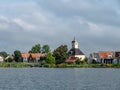 Church and houses of Durgerdam village from Buiten IJ river near Amsterdam, Netherlands Royalty Free Stock Photo