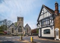 The church and impressive black at white building on the central roundabout in the village of St Lawrence, Ramsgate, UK