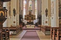 Church interior with statues and pulpit on side Royalty Free Stock Photo