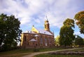 Church in Kernave surrounded by oaks