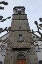 Church with limbs of a plane tree Royalty Free Stock Photo