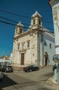 Church marble facade in front of street with old houses Royalty Free Stock Photo