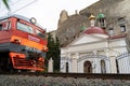 A church in the middle of a rocky stone mountain near a railway track in Crimea, Ukraine