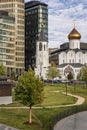 Church next to modern houses. Moscow, Russia, 09/30/2020 Royalty Free Stock Photo