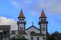 Church of Nossa Senhora da Alegria in Furnas with cloudy blue sky