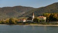Church and old school of Arnsdorf, river Danube on a sunny day in autumn Royalty Free Stock Photo