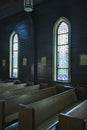 Church Pews with Stained Glass Windows Royalty Free Stock Photo