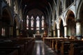 a church with pews and stained glass windows and a tiled floor with a long row of pews in front of the pews Royalty Free Stock Photo