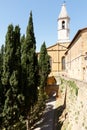 Church in PIenza, Tuscany, Italy with cypress trees Royalty Free Stock Photo