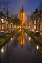Church reflected in a canal in Delft, The Netherlands