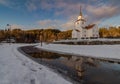 Church reflected in water, winter, snow and blue sky in Iveland Norway Royalty Free Stock Photo