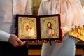 CHURCH OF THE RESURRECTION, VICHUGA, RUSSIA - NOVEMBER 03, 2019: Icon in the hands of the bride and groom at the wedding