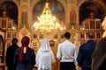 CHURCH OF THE RESURRECTION, VICHUGA, RUSSIA - NOVEMBER 03, 2019: Wedding ceremony of the groom with the bride and the