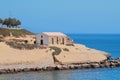 Church on rocky cape and sea. Porto-Torres, Italy Royalty Free Stock Photo