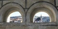Church and roofs thru windows in wall in Cesky Krumlov Royalty Free Stock Photo