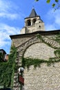 Church of Saint Germain des Pres. Bell tower with stone wall, ivy and Metro sign from the Boulevard Saint Germain. Paris, France. Royalty Free Stock Photo