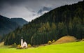 The church of Saint John, Ranui,  Chiesetta di san giovanni in Ranui Runes South Tyrol Italy, surrounded by green meadow, forest Royalty Free Stock Photo