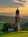 Church Saint Valentin and Shlern mountain in Italian village Castelrotto in Dolomites Alps. South Tyrol, Italy, Europe