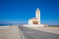 Church of Salinas of Cabo de Gata next to the road and the beach in Almeria