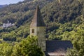 The Church of San NicolÃÂ² with the Benedictine Abbey of Monte Maria in the background, Burgusio, South Tyrol, Italy