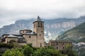 Church of San Salvador in Torla - Ordesa, with Monte Perdido in the background on a foggy day. Pyrenees Royalty Free Stock Photo