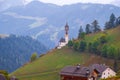 Church of Santa Barbara in the cozy little village of La Valle on a foggy morning, Alta Badia, South Tyrol Royalty Free Stock Photo