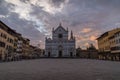 Church of Santa Croce in Florence in Tuscany in Italy during the sunrise with empty square and orange clouds Royalty Free Stock Photo