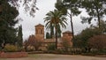 Church of Santa Maria de Alhambra, in Jardins del Paraiso garden, Granada, Spain, on a cloudy day Royalty Free Stock Photo