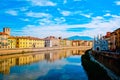 Church Santa Maria della Spina on the Arno river embankment in Pisa with colorful old houses, Italy, Europe. Royalty Free Stock Photo