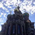 Church of the Savior on Blood in Saint Petersburg on the background of bright blue sky with clouds. Bottom view Royalty Free Stock Photo