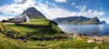 Church by the sea with ocean and mountain panorama, Vidareidi, ViÃÂ°areiÃÂ°i, Faroe Islands, Denmark, Northern Europe Royalty Free Stock Photo