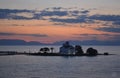 Church in the sea at sunset in peloponnese, Greece Royalty Free Stock Photo