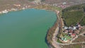 Church on the shore of Lake Abrau, shot from the drone. Beautiful futage of a quiet village and church by the lake