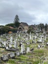 Church silhouette against dark skies, countless tombstones reaching skyward