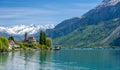 Church with snowy alps over Brienz lake in Switzerland Royalty Free Stock Photo