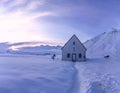 Church on the snowy Cross Pass on the Georgian Military Highway during sunset