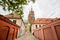 Church spiers of historical district of the polish city with narrow cobbled streets