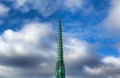 Church spire against cloudy blue sky Royalty Free Stock Photo