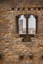 Church spire through a medieval wall