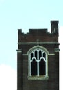 Church square brick bell tower with gothic window Royalty Free Stock Photo