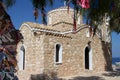 Church of St. Elijah in Protaras from under the branches of a tree tied with colored ribbons . Cyprus Royalty Free Stock Photo